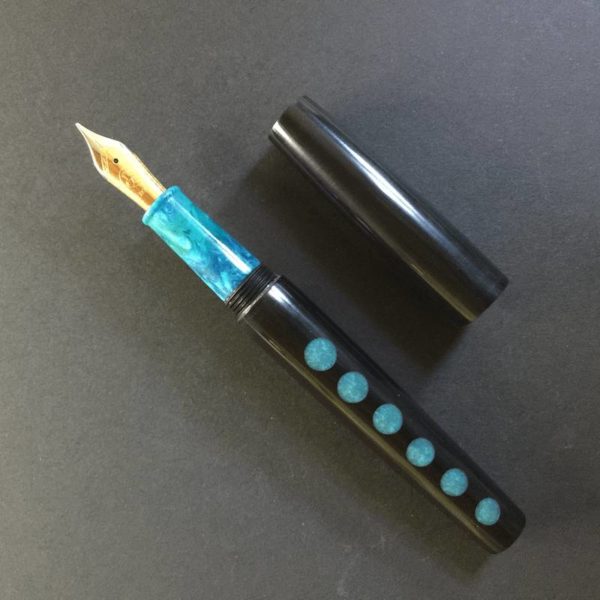 Showing a Bock nib in polished silver and gold plate