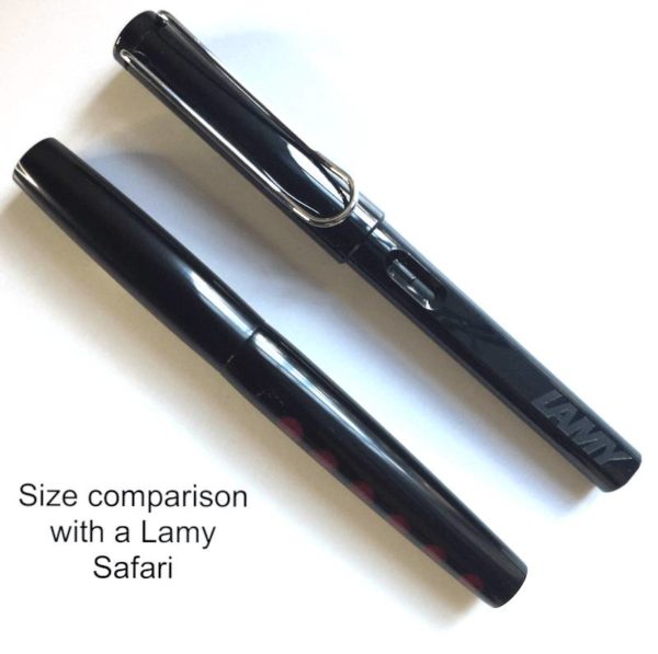Two pens side by side for size comparison: Moons of Jupiter Amalthea compared to a black Lamy Safari. They are similar in size.