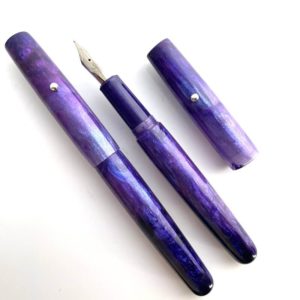 2 matching pens in a silvery lilac colour, one capped the other uncapped
