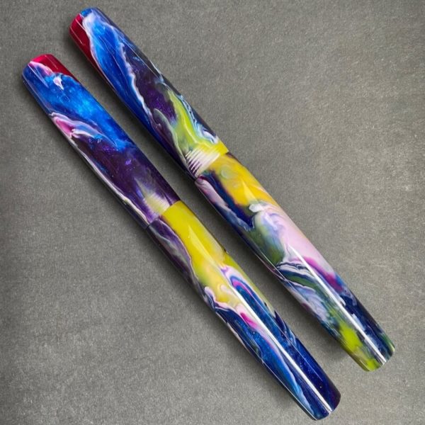 Matching pair of fountain pens in Harlequin's Jitterbug material which is a brightly coloured mixture