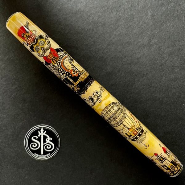 Fountain pen with a portrait of a steampunk character on the cap and an airship on the barrel