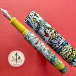 Painting on a fountain pen of a girl holding a red journal, riding on a snail.